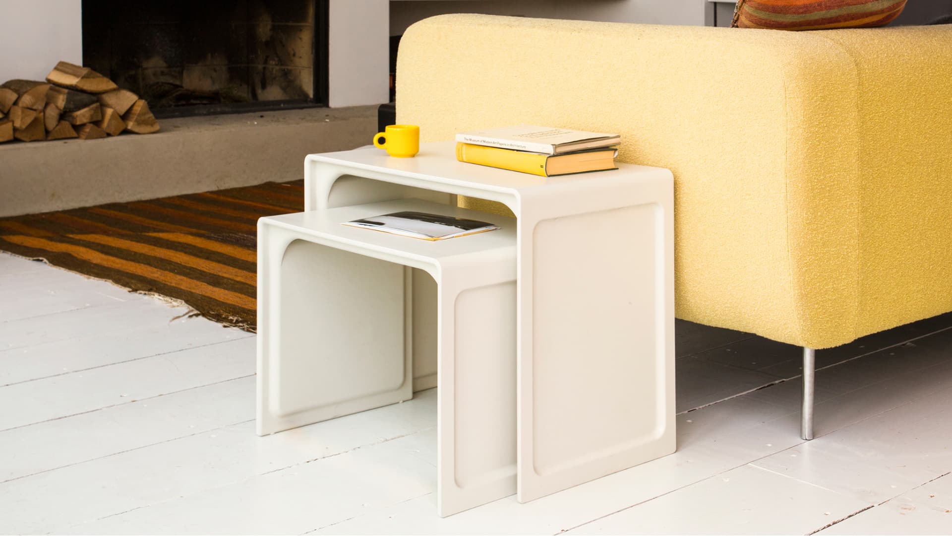 Vitsœ 621 nesting tables in off-white used as a side table in the living room