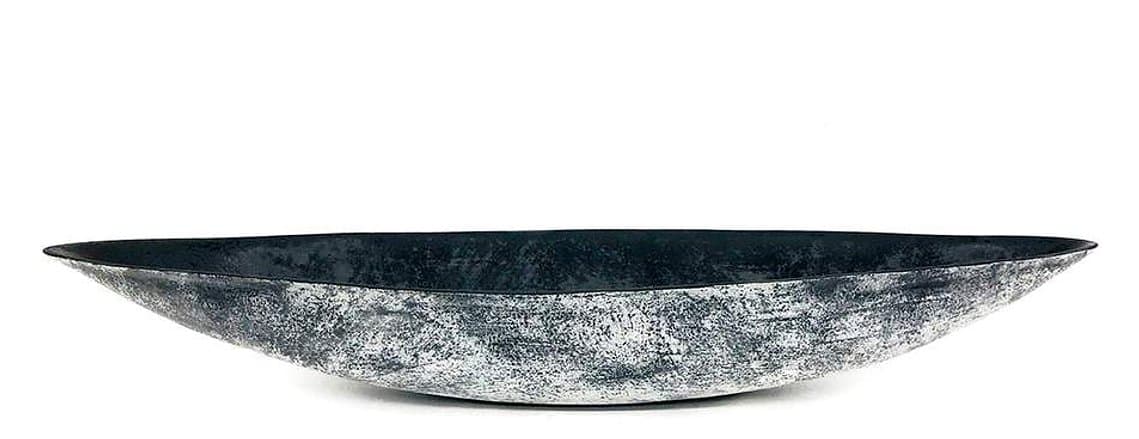 White and Black Boat is a stoneware vessel hand-built by artist Kathy Erteman, who is known for minimal forms and sculptural clay objects. Slab-built, the oblong ceramic sculpture has a black glazed interior, and a black and white textured exterior.