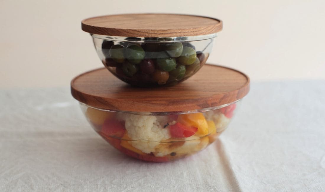 Wooden-lidded KOBO glass bowls by Peter Ivy in collaboration with Midori Takahashi