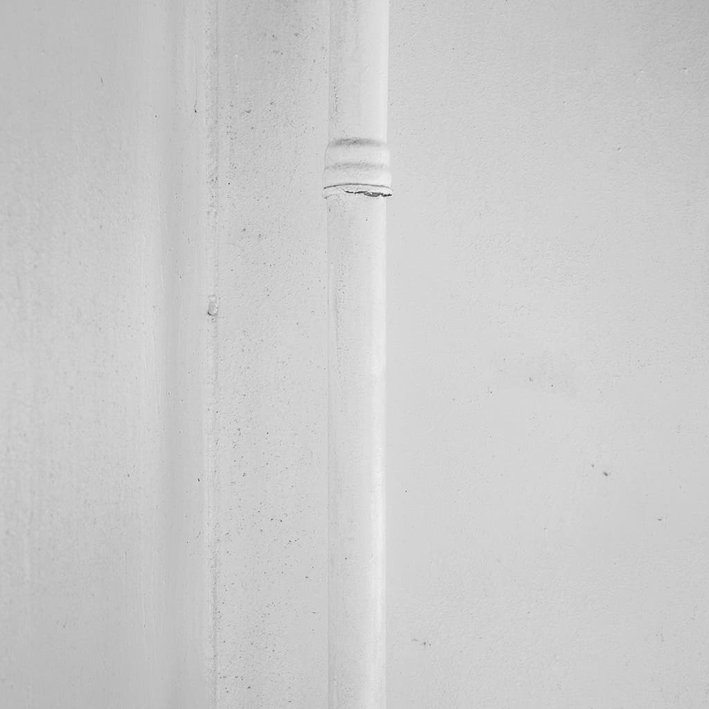 Whitescapes 58 — slender white pipe and textured ship wall (2014 award submission)
