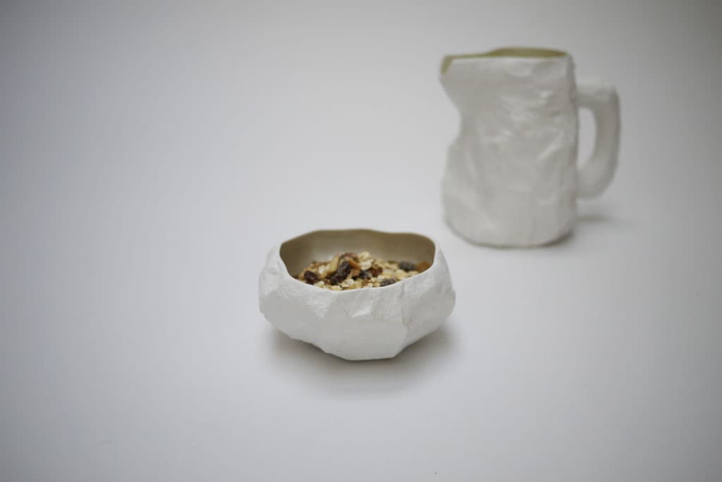 White Crockery bowl with breakfast food and the matching jug
