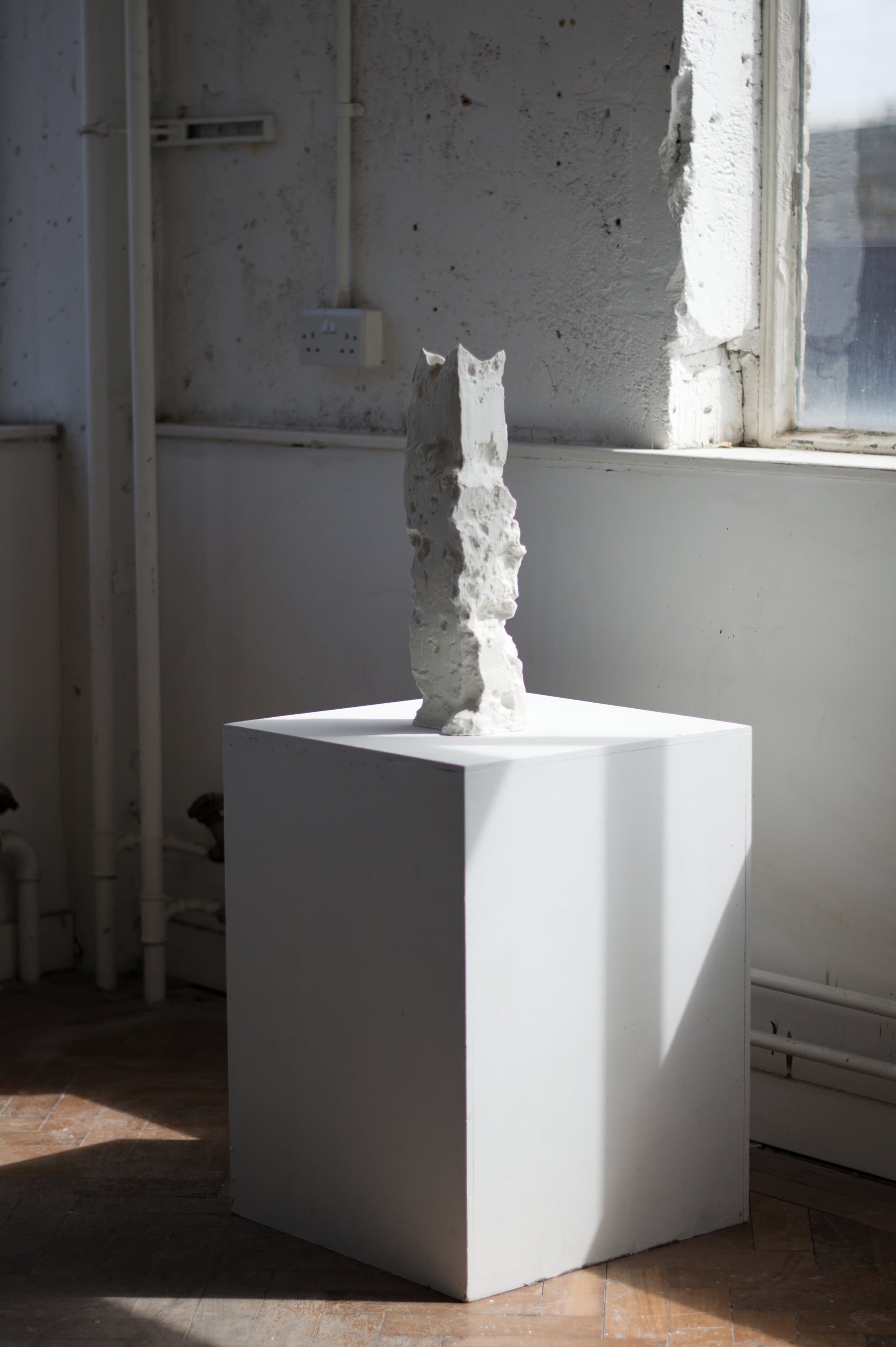 Dug no. 9 (2019) — tall porcelain piece on a plinth