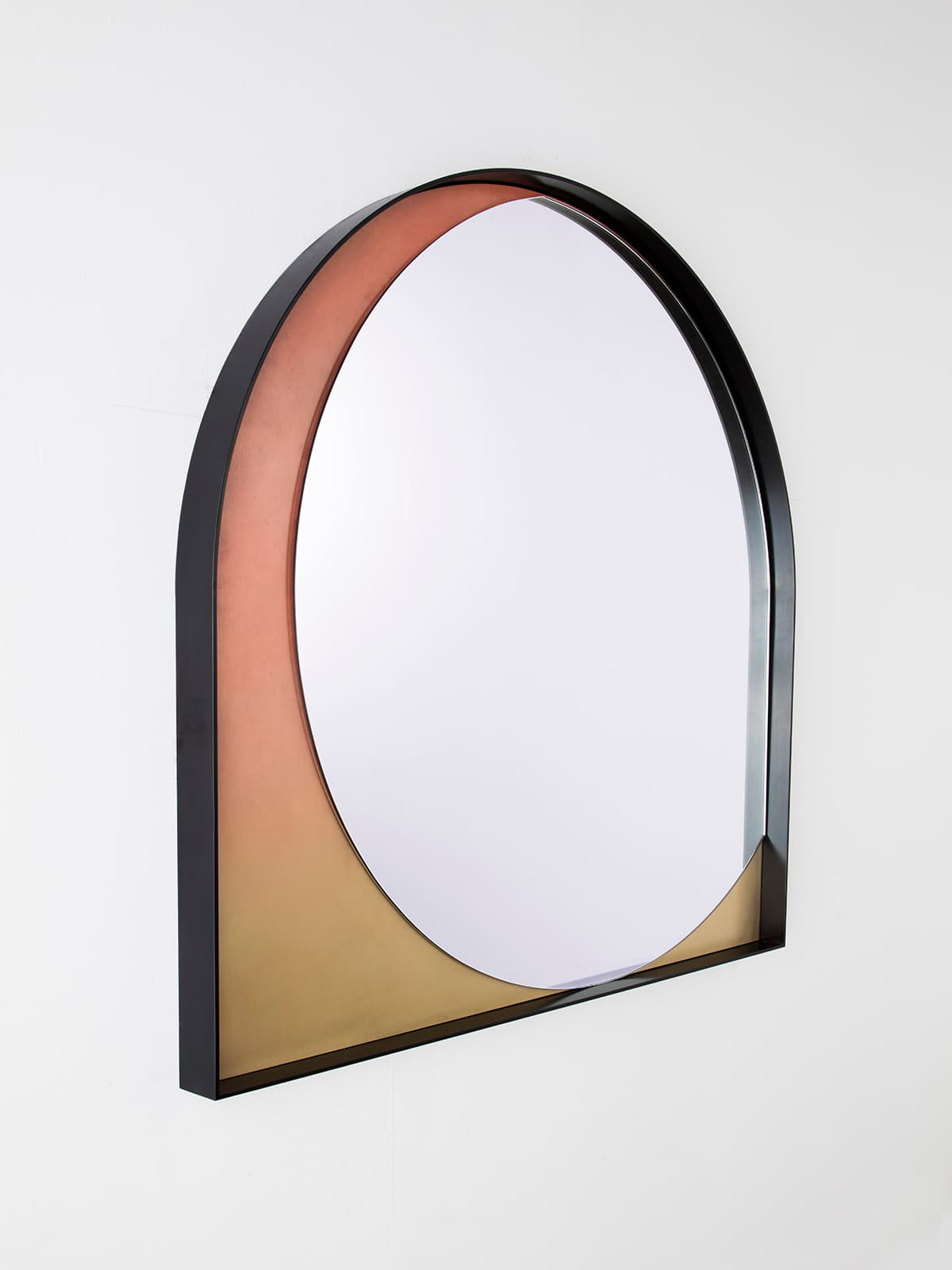 Slip Mirror in Rose Gradient by Kin & Company, showing the depth of its blackened frame from the side
