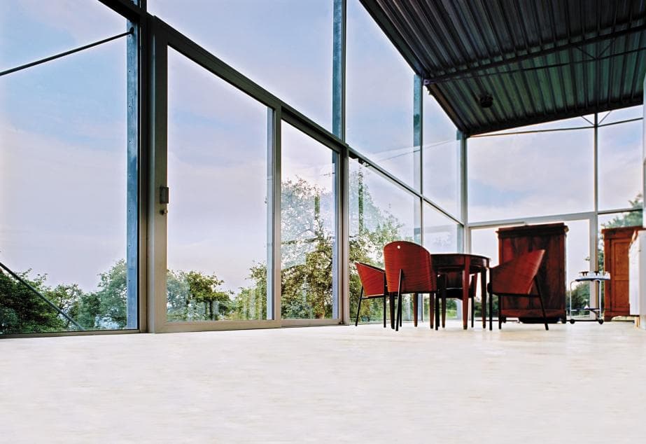 Denis-Ortmans House: interior dining area and glazed facade