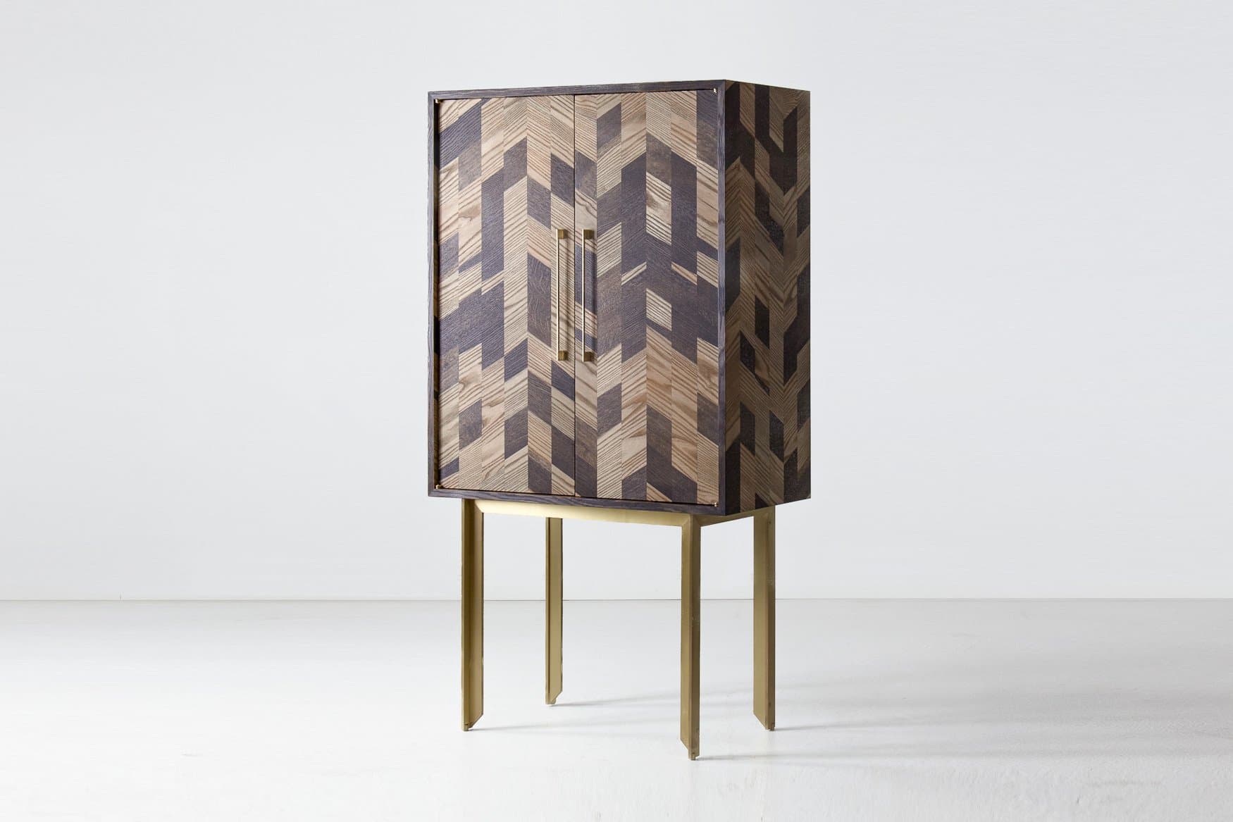 Dorothy Dry Bar by TOKEN, with geometric wood marquetry, long metal handles and a brass-colored base