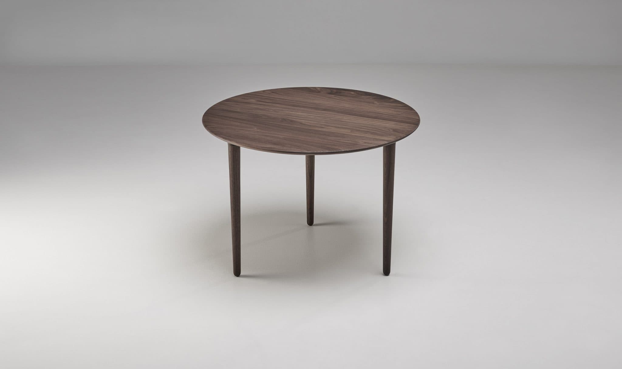 Evja round coffee table, designed by Torbjørn Bekken in 1958, in a dark-wood finish
