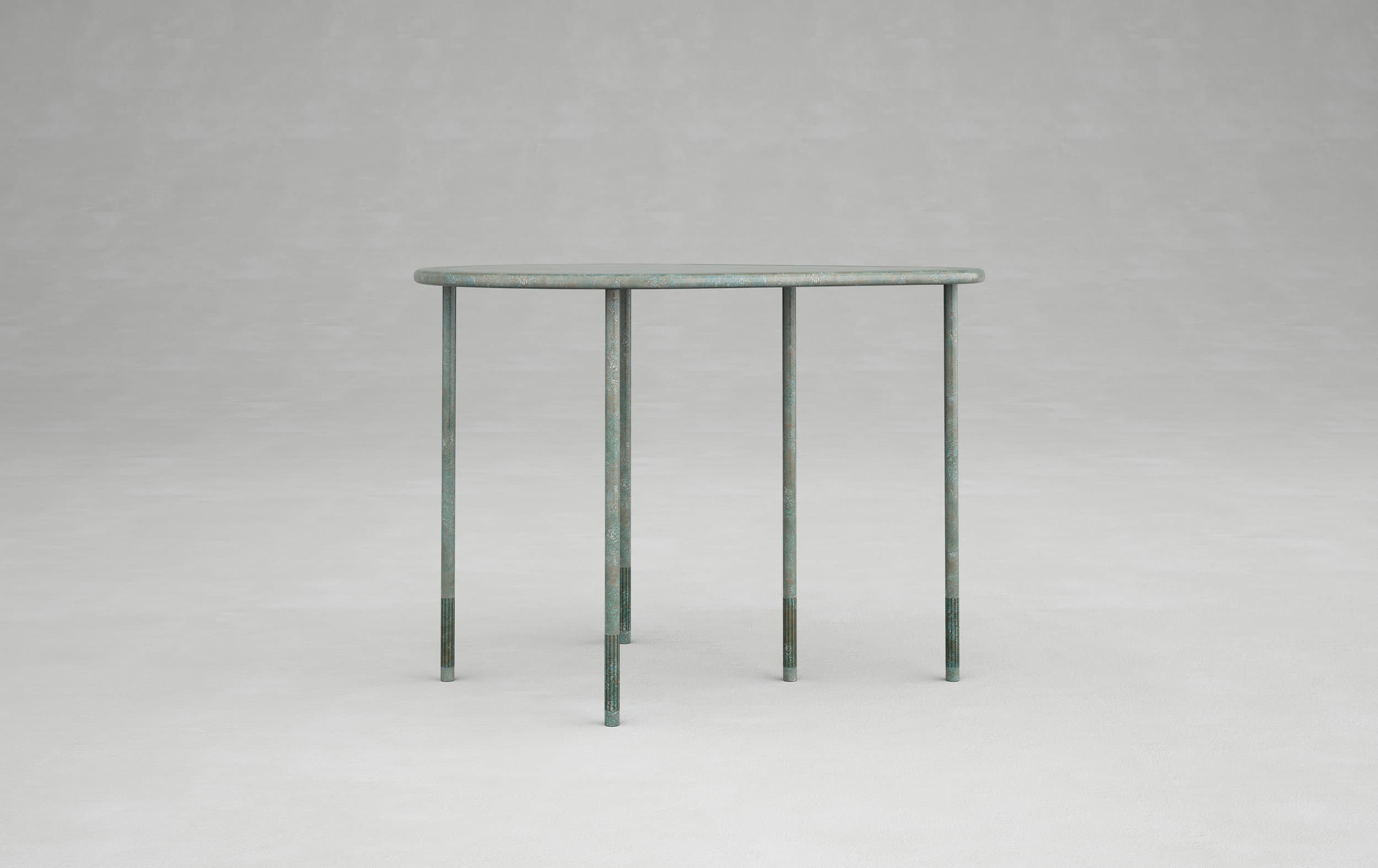 Small round blue-green table with five slender legs against a grey background.