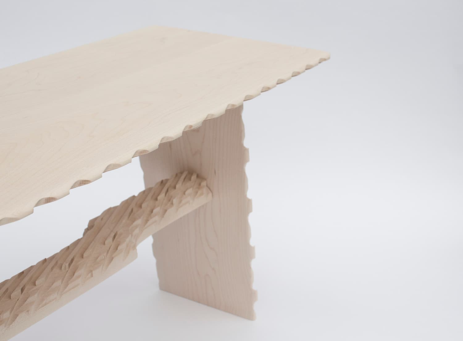 Detail of the CNC-textured edge, stretcher and leg of Rustic Stool 1.0