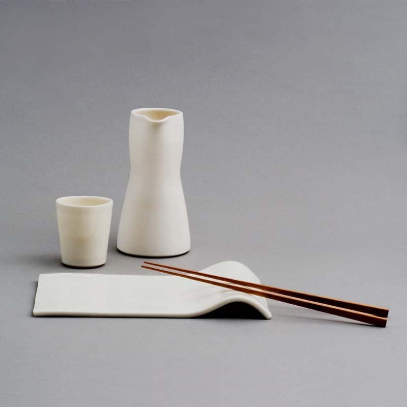 Ann Linnemann: porcelain sushi plate with integrated chopstick rest, cup and jar.