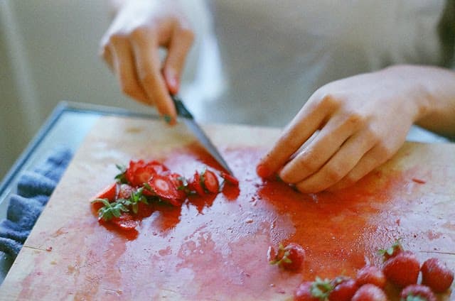 Molly Wizenberg: preparing strawberries, summer2010.