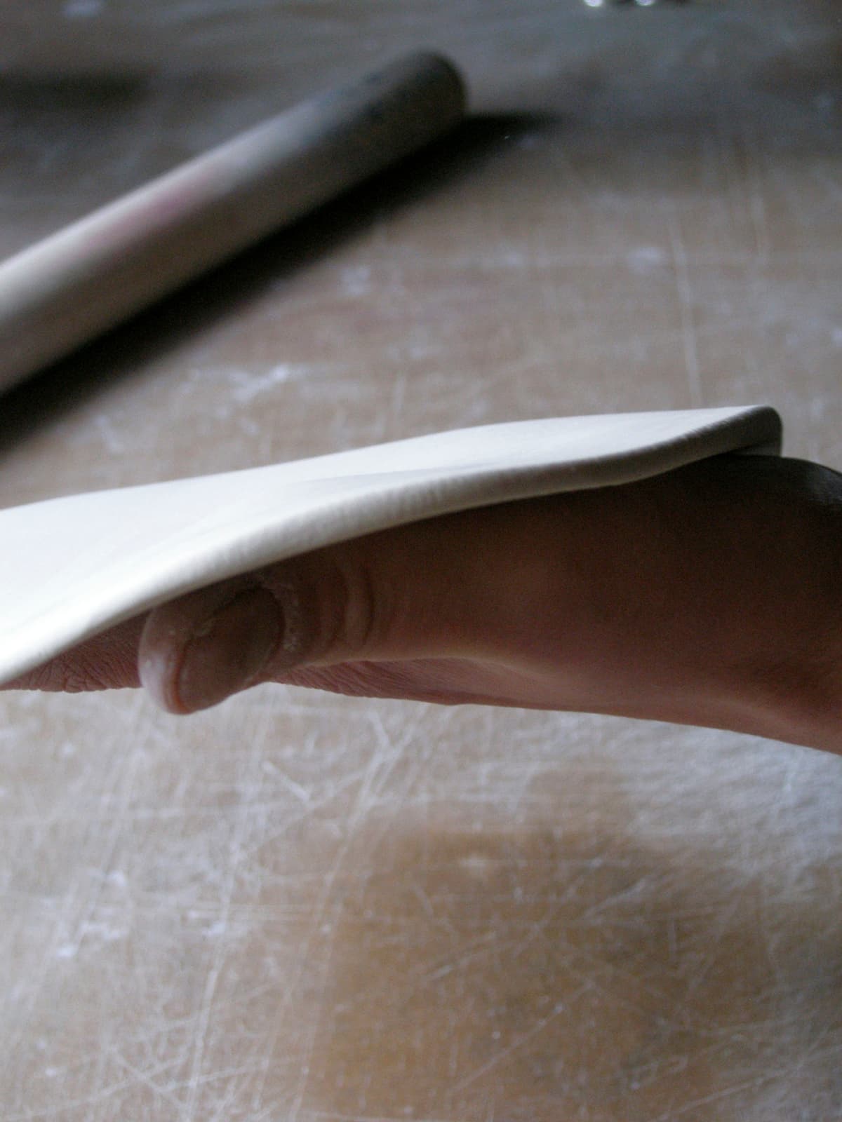 Justine Allison: handling a thin clay slab. Photograph by Toril Brancher.