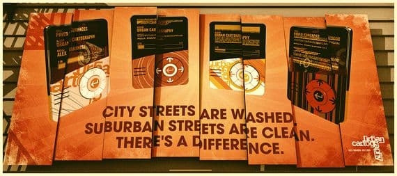 Urban Cartography by Alex Varanese, showing three-dimensional street signs and the words City streets are washed, suburban streets are clean.