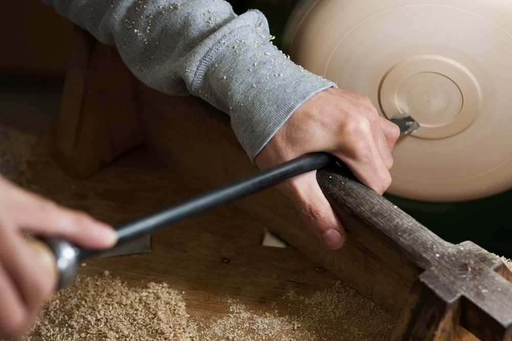 Kenichi Fujii turning a wooden vessel on the lathe