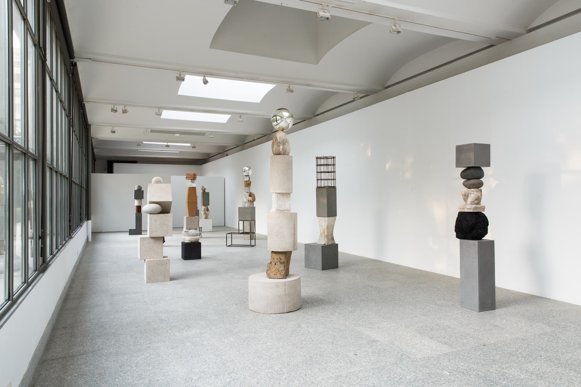 Wide view of Jose Dávila’s 2018 Royal Botanical Garden installation, with vertical assemblages in a windowed gallery