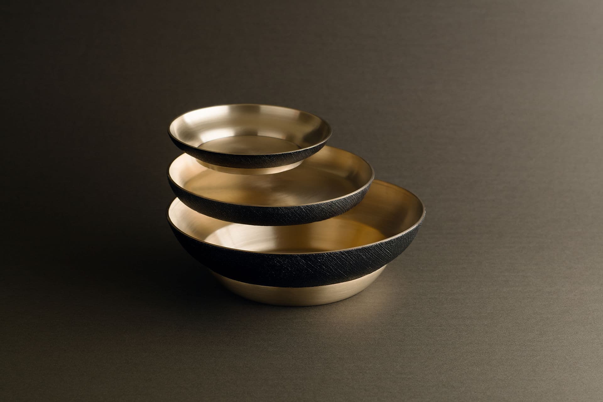 Full Moon tableware by Chaehoon Moon for Damoon, three stacked brass vessels with dark lacquer exteriors
