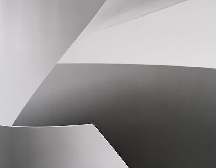 Rounded steel staircase by E2A Architekten, 2012: abstract curved steel detail