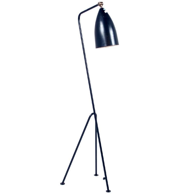 A black tripod floor lamp with a curved upright and a long adjustable conical shade against a white background.