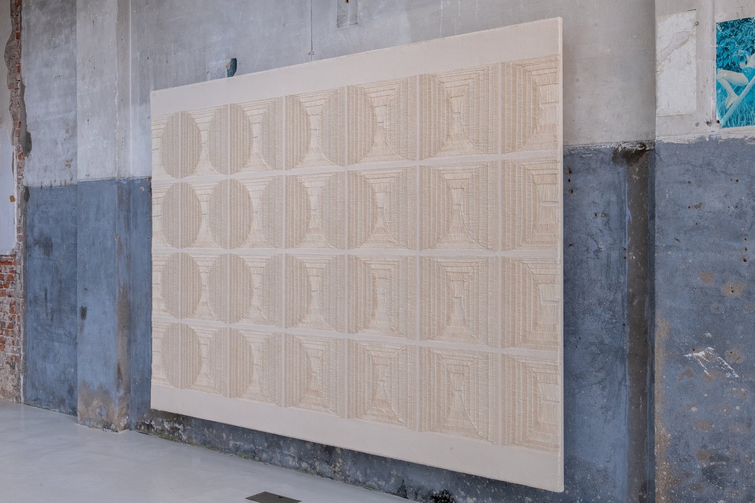 An oblique view revealing circular forms and depth in the cotton canvas.